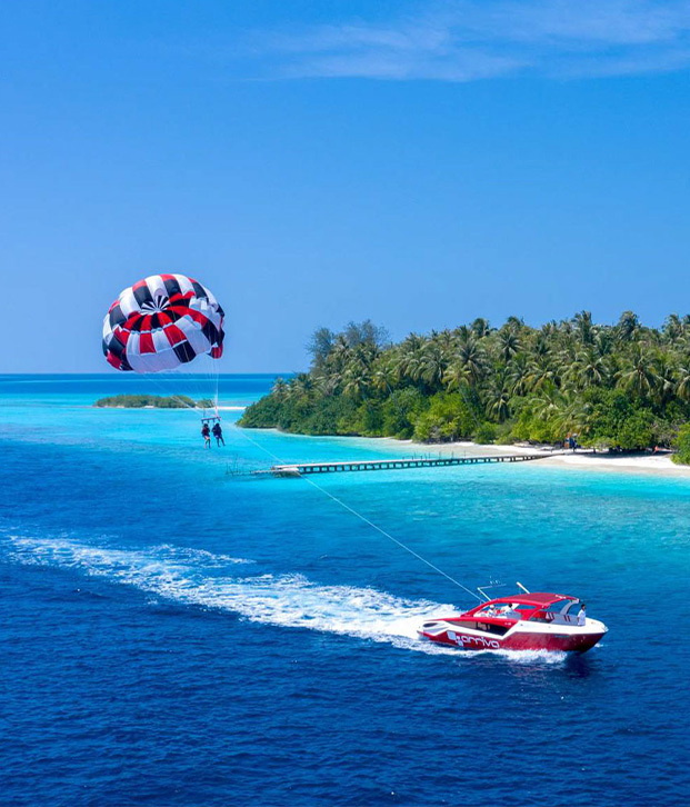 Aerial view of Arriva Parasailing speedboat making a sharp turn, showcasing the high-speed and dynamic speedboat transfer services in the Maldives.